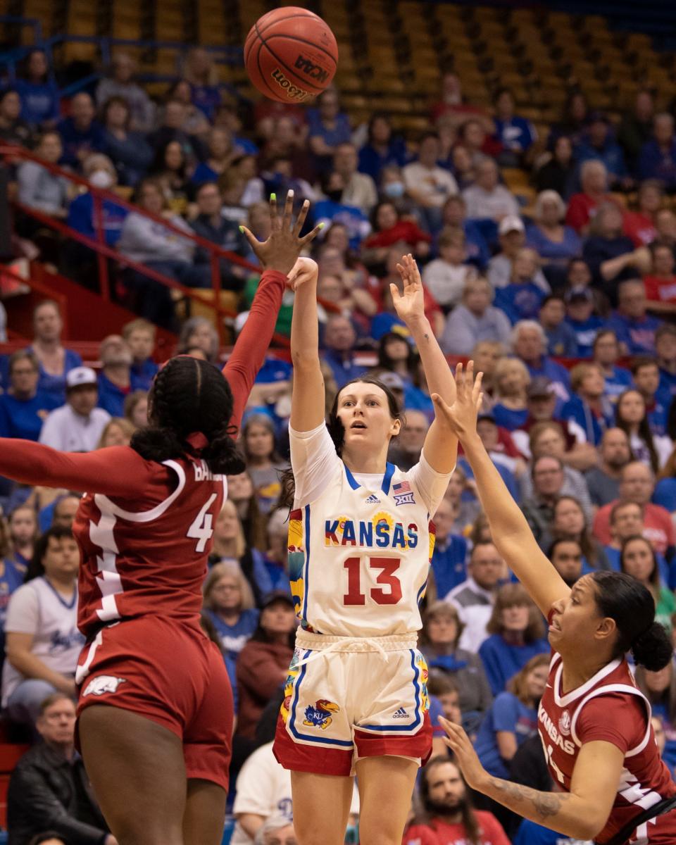 Kansas guard Holly Kersgieter (13) shoots the ball Sunday against Arkansas during a game in the 2023 Postseason WNIT inside Allen Fieldhouse.