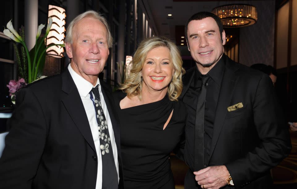 Olivia pictured with Paul Hogan and John Travolta. Source: Getty
