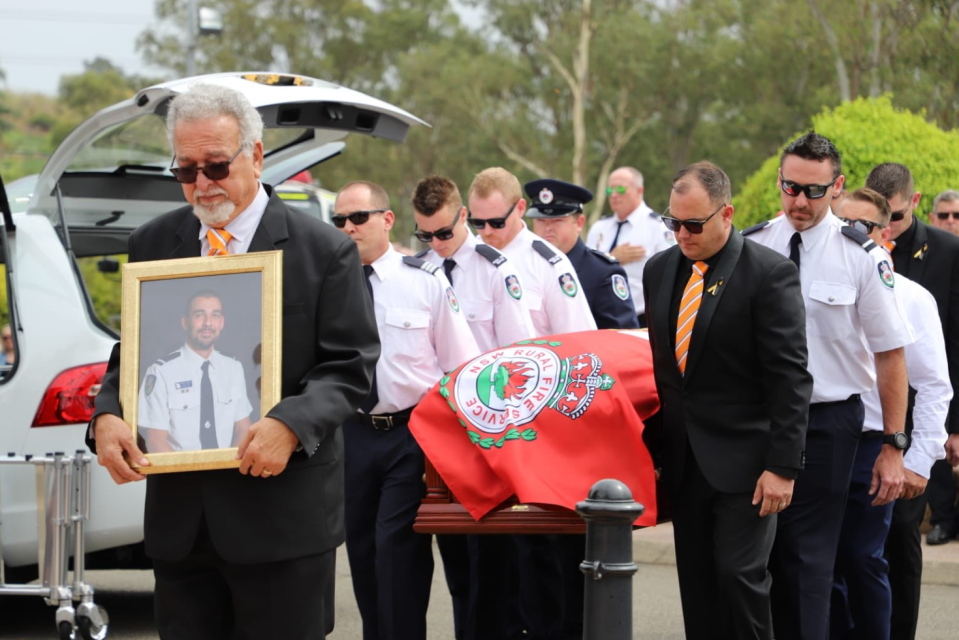 Colleagues carry the coffin of Andrew O'Dwyer on Tuesday. Source: NSW RFS