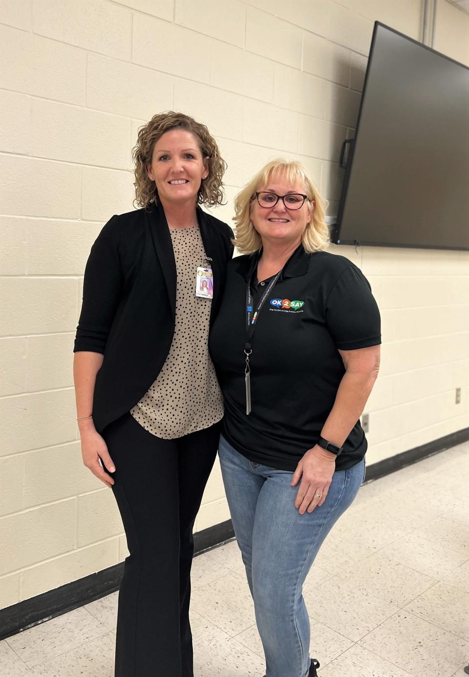 Onsted Middle School Principal Alaina Ellison, left, stands with former Vandercook Lake Public Schools principal Micki Cardwell, who is a presenter with Michigan's student safety program OK2SAY. Cardwell visited Onsted Middle School in January to speak with students about the benefits of using OK2SAY.