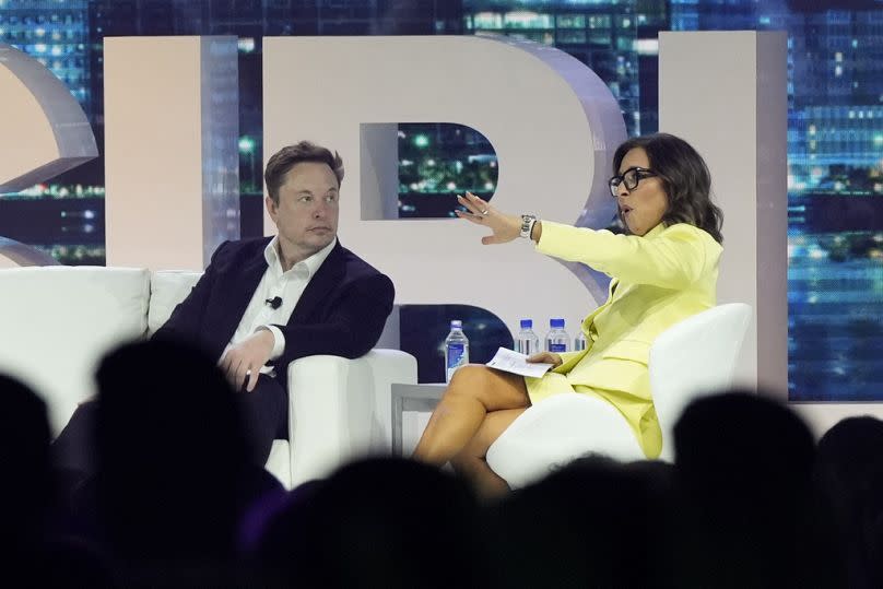 Elon Musk with X/Twitter CEO Linda Yaccarino at an event in Florida.