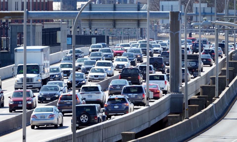 On the single, southern span of the Washington Bridge still open to automotive traffic, cars stream east and west on Interstate 195 in lanes narrowed to increase capacity. The state on Tuesday put out a request for proposals to build a replacement for the closed, northern span.