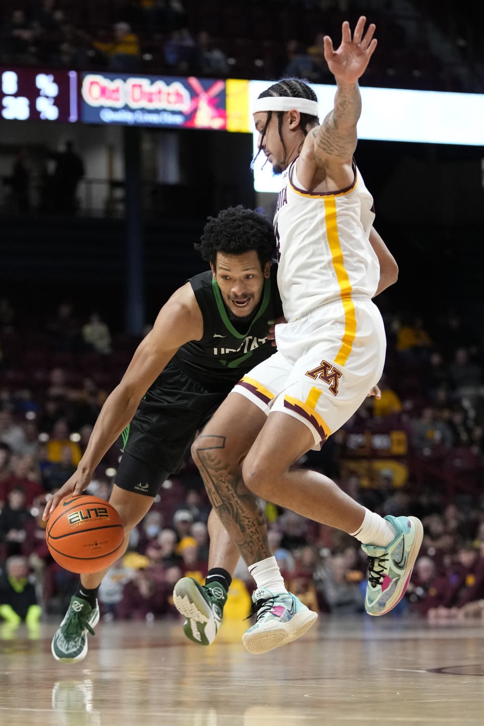 USC Upstate guard Trae Broadnax, left, works toward the basket as Minnesota guard Braeden Carrington defends during the second half of an NCAA college basketball game, Saturday, Nov. 18, 2023, in Minneapolis. (AP Photo/Abbie Parr)