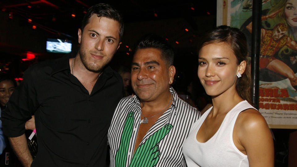 FILE - In this June 28, 2007 file photo, Harry Morton, left, Luis Barajas, center, founder of Flaunt magazine, and Jessica Alba are seen at the opening of the Pink Taco restaurant in Los Angeles. Harry Morton, a restaurant mogul who is the son of the Hard Rock Cafe chain co-founder and grandson of the Morton's The Steakhouse founder, has died. Pink Taco, a restaurant business Morton founded and previously owned, confirmed his death in a statement Sunday, Nov. 24, 2019. He was 38. (AP Photo/Chris Polk, File)