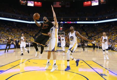 Jun 4, 2017; Oakland, CA, USA; Cleveland Cavaliers guard Kyrie Irving (2) shoots against Golden State Warriors guard Klay Thompson (11) and forward Kevin Durant (35) during the second half in game two of the 2017 NBA Finals at Oracle Arena. Mandatory Credit: Ezra Shaw/Pool Photo via USA TODAY Sports