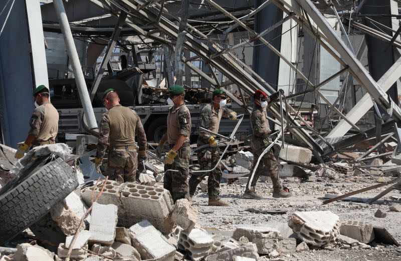 Members of the French military wear face masks during a joint effort with Lebanese army to clear the rubble from port of Beirut