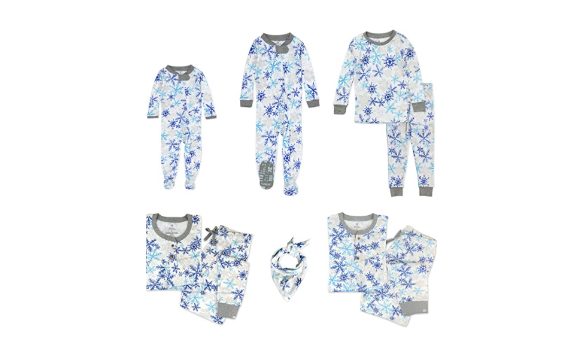 Snowflake adorned pajamas for the whole family, from baby onesies to adult sets to a bandana for the dog.