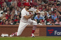 St. Louis Cardinals' Adam Wainwright hits a sacrifice bunt to score Harrison Bader during the fourth inning of a baseball game against the Milwaukee Brewers Tuesday, Sept. 28, 2021, in St. Louis. (AP Photo/Jeff Roberson)