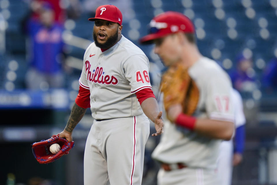 Philadelphia Phillies relief pitcher Jose Alvarado (46) talks to the New York Mets bench after hitting Michael Conforto with a pitch during the sixth inning in the first game of a baseball doubleheader Tuesday, April 13, 2021, in New York. (AP Photo/Frank Franklin II)