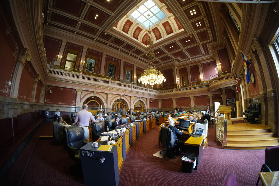 Senators toil in the body's chambers, Monday, May 8, 2023, in the State Capitol in Denver. (AP Photo/David Zalubowski)
