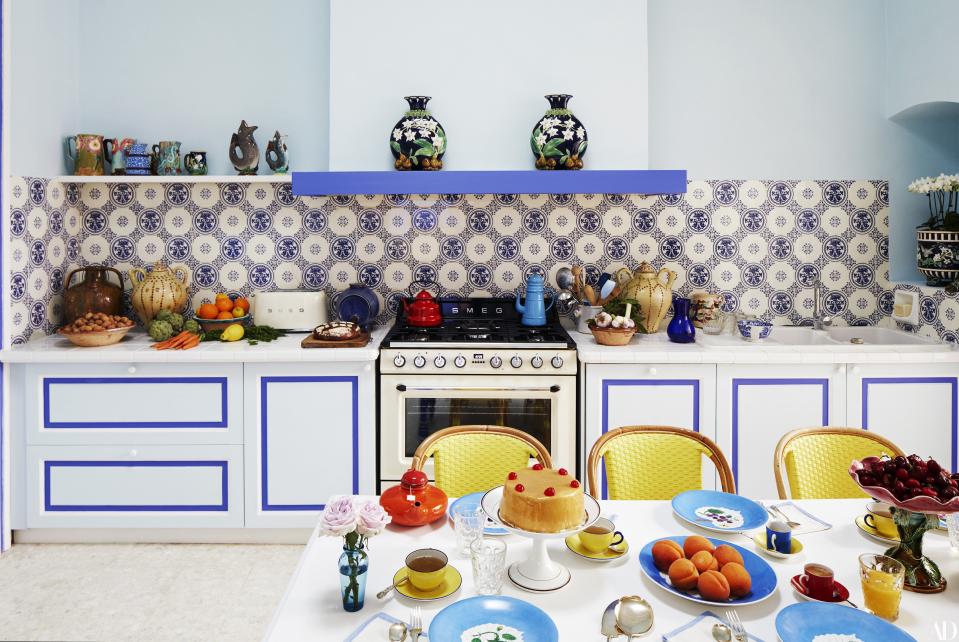 Original wall tiles in the kitchen show the city of Sète’s coat of arms. George Jones majolica vases, c. 1875; Smeg range and toaster; Colette Gueden plates; Delphin Massier fruit stand; chairs by Drucker.