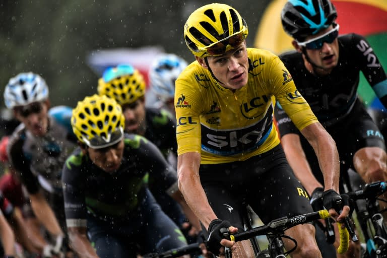Colombia's Nairo Quintana (L), Great Britain's Christopher Froome (C), wearing the overall leader's yellow jersey, and Netherlands' Wouter Poels ride in the pack during the 146,5 km twentieth stage of the 103rd edition of the Tour de France
