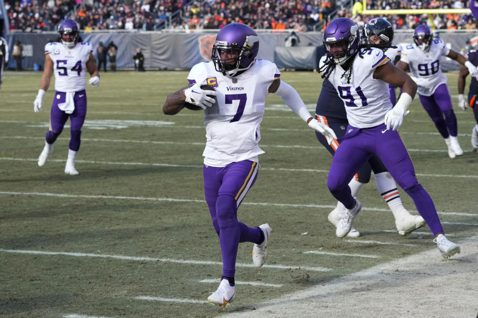 Minnesota Vikings cornerback Patrick Peterson (7) runs up field after intercepting a pass during the first half of an NFL football game against the Chicago Bears, Sunday, Jan. 8, 2023, in Chicago. (AP Photo/Charles Rex Arbogast)