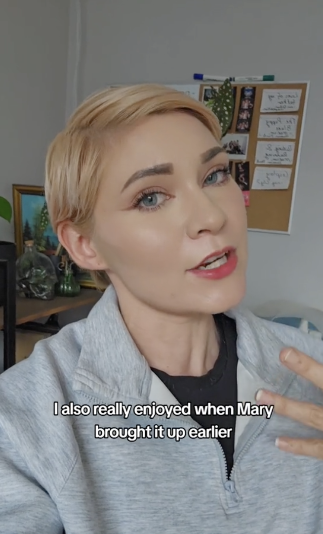 Woman gestures while speaking, caption reads "I also really enjoyed when Mary brought it up earlier." She's in a casual setting with a bulletin board behind