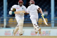 West Indies batsman Narsingh Deonarine (L) and teammate Shivnarine Chanderpaul (R) run during the third day of the second-of-three Test matches between Australia and West Indies April 17, 2012 at Queen's Park Oval in Port of Spain, Trinidad. AFP PHOTO/Stan HONDA (Photo credit should read STAN HONDA/AFP/Getty Images)