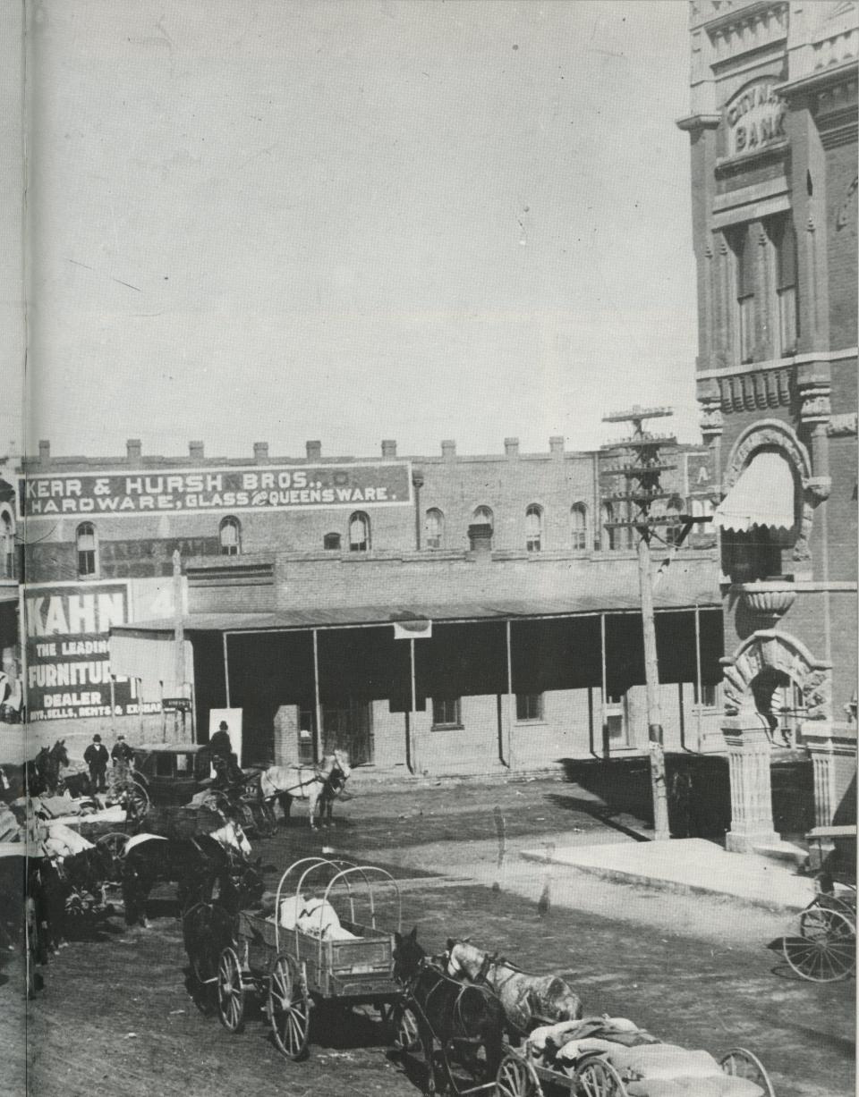 The telephone pole in this undated photo marks the spot where bank robbers Elmer Lewis and Foster Crawford were lynched in 1896. They had robbed City National Bank, seen at the right, and shot and killed cashier Frank Dorsey.