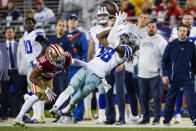 Dallas Cowboys wide receiver CeeDee Lamb (88) catches a pass in front of San Francisco 49ers cornerback Deommodore Lenoir (38) during the second half of an NFL divisional round playoff football game in Santa Clara, Calif., Sunday, Jan. 22, 2023. (AP Photo/Tony Avelar)
