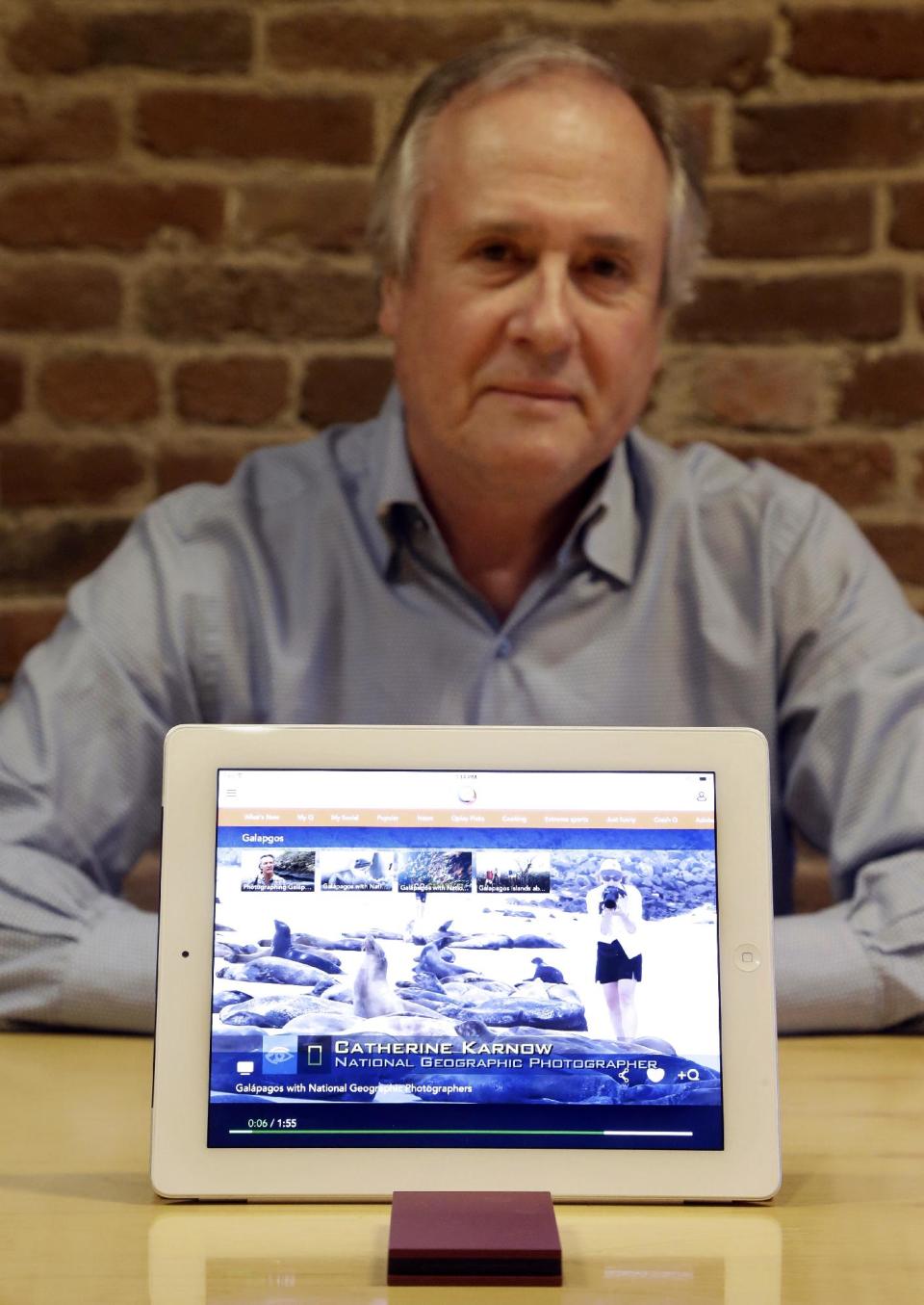 In this Friday, Feb. 21, 2014, photo, Mike Ramsay, CEO of Qplay, poses for photographs after giving a demonstration of Qplay on a tablet device in San Francisco. (AP Photo/Jeff Chiu)