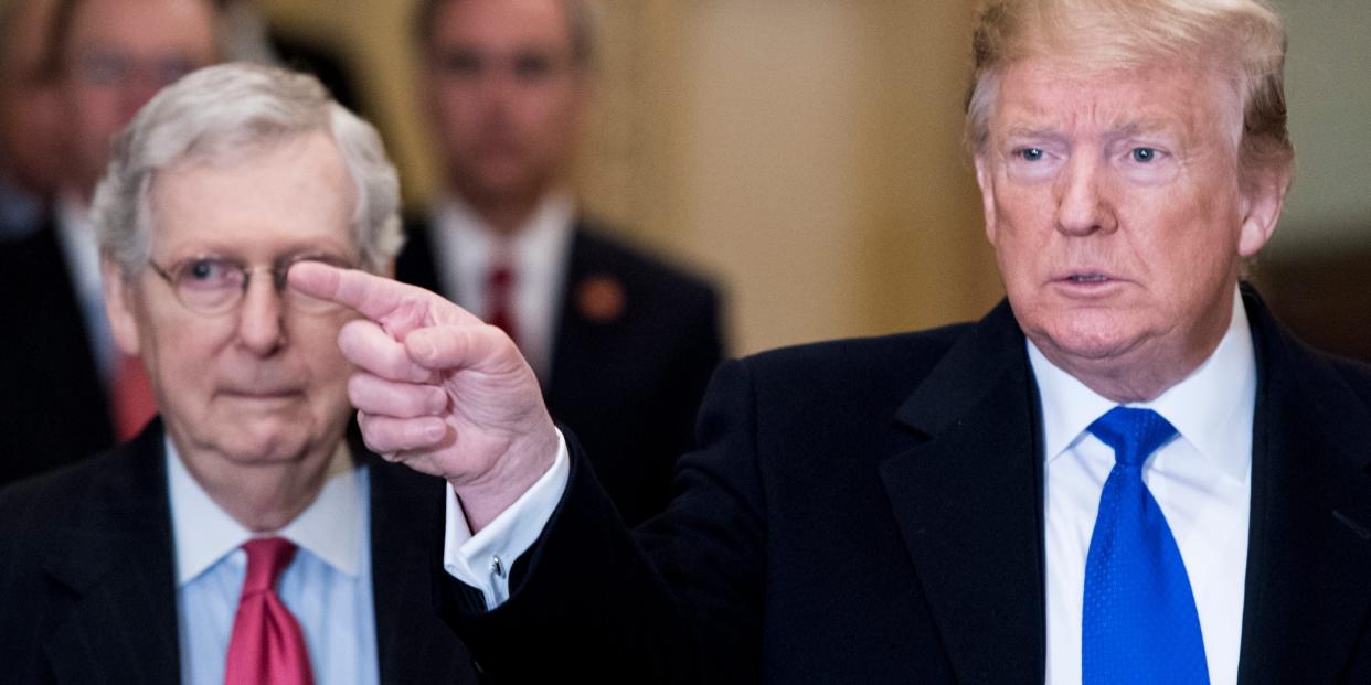 President Donald Trump takes questions from reporters he arrives with Senate Majority Leader Mitch McConnell, R-Ky., for the Senate Republicans' lunch in the Capitol on Tuesday, March 26, 2019.