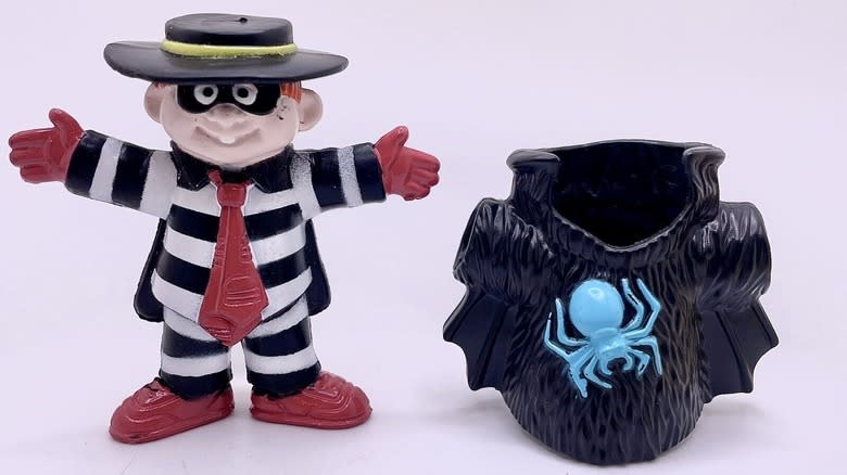 Hamburglar toy beside costume