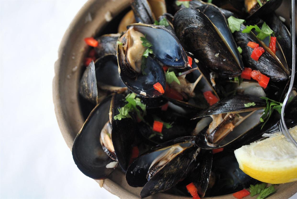 Thai Green Curry Mussels. Cocmut milk, shallots, peppers and ginger. Served at Pattigeorge's located on Longboat Key Florida.