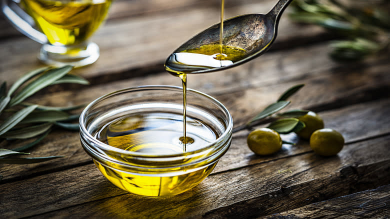 pouring extra virgin olive oil