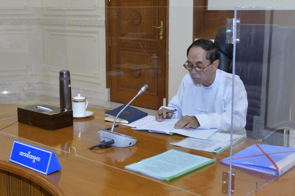 In this photo released from the military The Military True News Information Team, Myint Swe, acting President of the military government, attends the National Defense and Security Council meeting Tuesday, Jan. 31, 2023, in Naypyitaw, Myanmar. As Feb. 1, 2023, marks two years after Myanmar’s generals ousted Aung San Suu Kyi’s elected government, thousands of people have died in civil conflict and many more have been forced from their homes in a dire humanitarian crisis. (The Military True News Information Team via AP)