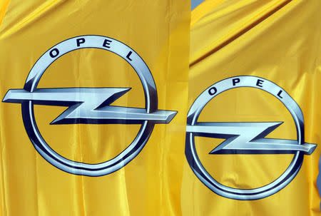 Logos of German car maker Opel are seen on banners at a dealership in Nice, France, February 23, 2017. REUTERS/Eric Gaillard