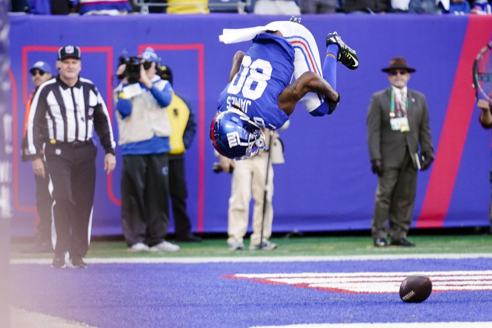 New York Giants' Richie James (80) does a flip as he celebrates after scoring a touchdown during the first half of an NFL football game against the Indianapolis Colts, Sunday, Jan. 1, 2023, in East Rutherford, N.J. (AP Photo/Seth Wenig)