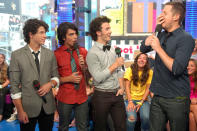 <p>When MTV’s <em>TRL</em> came calling, the JoBros were there. They chatted with VJ Damien Fahey on Aug. 11. (Photo: Michael Loccisano/FilmMagic) </p>