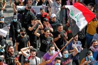 Iraqi students and activists march in Baghdad for protests anniversary, gather in Tahrir square