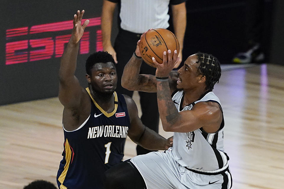 New Orleans Pelicans rookie Zion Williamson guarding San Antonio Spurs star DeMar DeRozan