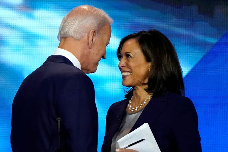 FILE PHOTO: Former Vice President Biden talks with Senator Harris after the conclusion of the 2020 Democratic U.S. presidential debate in Houston