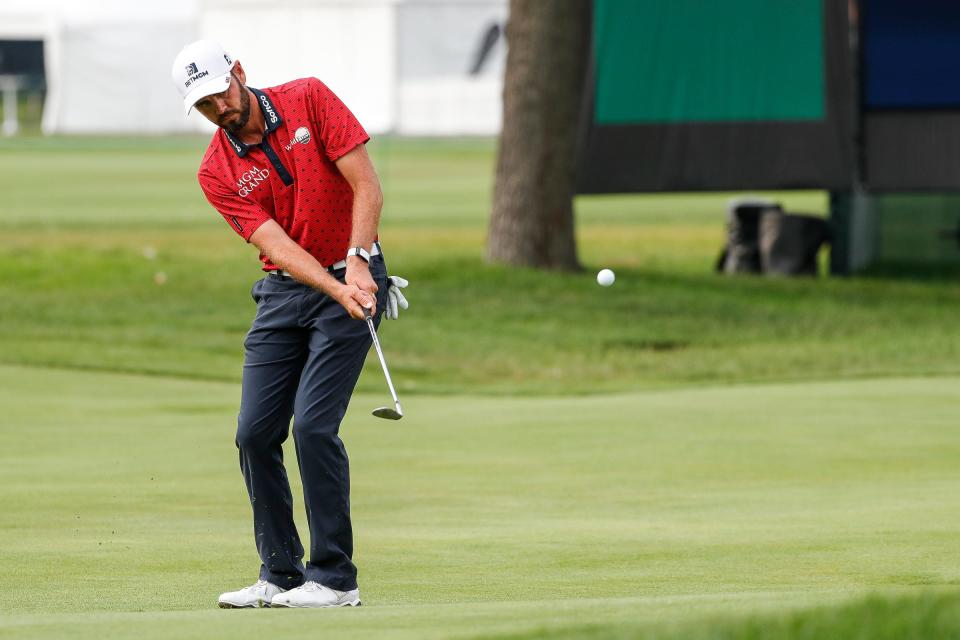 Troy Merritt hits an approach shot from the 16th fairway during the third round of sudden death playoff of Rocket Mortgage Classic at the Detroit Golf Club in Detroit, Sunday, July 4, 2021.