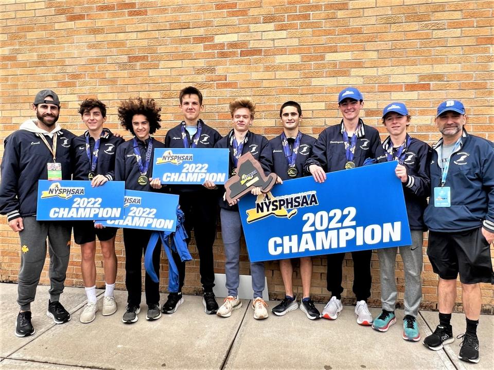 Bronxville runners and their coaches after the Broncos won the state boys Class C cross-country team championship Nov. 12, 2022 in Verona, New York