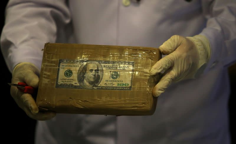 FILE PHOTO: A cocaine brick seized during an operation is displayed to the media at the Peruvian police headquarters in Lima