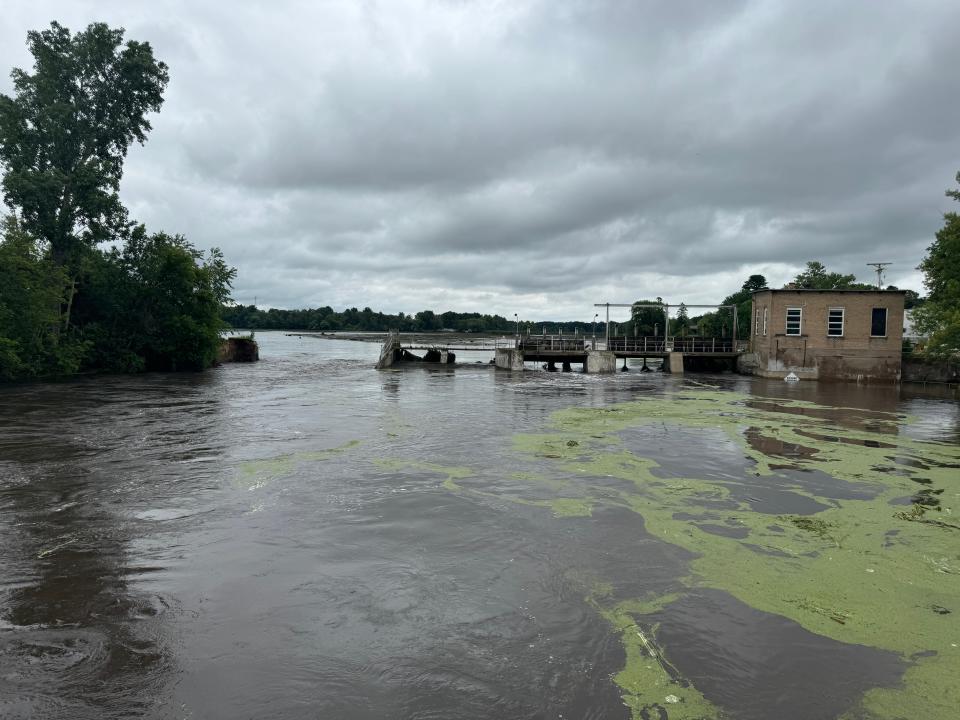 Manawa mill pond dam, as seen at about 5 p.m. Friday night, July 5 from a bridge on State 22 in Manawa, Wisconsin. After flooding eroded the side of the dam Friday, water flowed into the Little Wolf River until the water levels became the same.