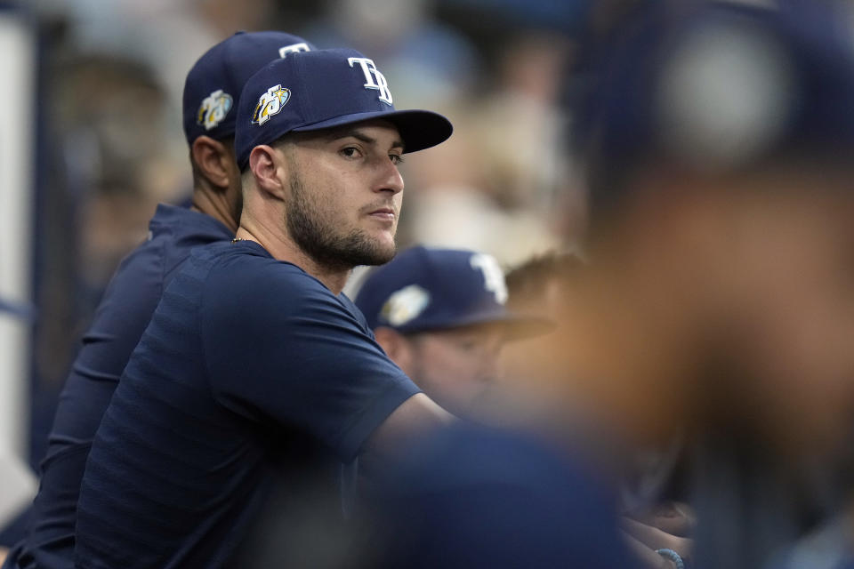 Tampa Bay Rays pitcher Shane McClanahan watch from the dugout against the St. Louis Cardinals during the seventh inning of a baseball game Tuesday, Aug. 8, 2023, in St. Petersburg, Fla. McClanahan is out with an arm injury. (AP Photo/Chris O'Meara)