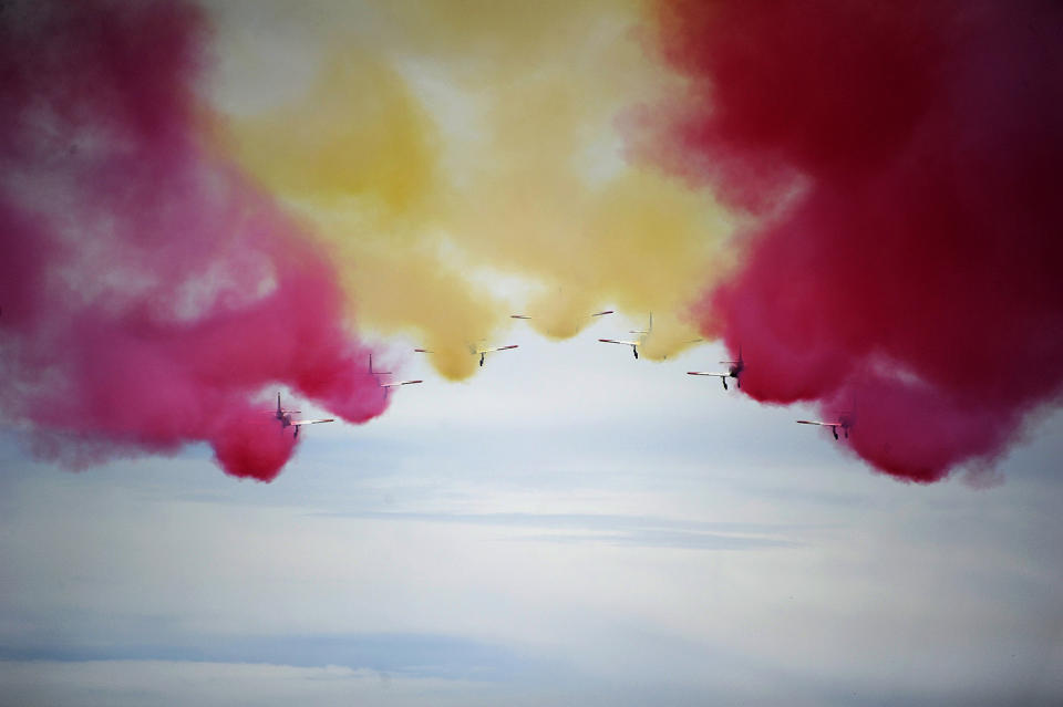 <p>The Patrulla Aguila (Eagle Patrol), the Spanish Air Force’s acrobatic demonstration team, performs during the Spanish Red Bull Moto3 Grand Prix at the Jerez de la Frontera racetrack, May 7, 2017. (Cristina Quicler/AFP/Getty Images) </p>