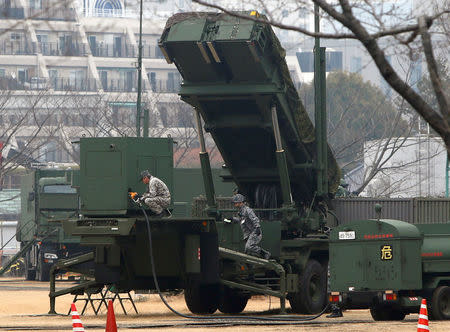 Japan Self-Defense Forces soldiers inject fuels into a unit of Patriot Advanced Capability-3 (PAC-3) missiles at the Defense Ministry in Tokyo. REUTERS/Kim Kyung-Hoon