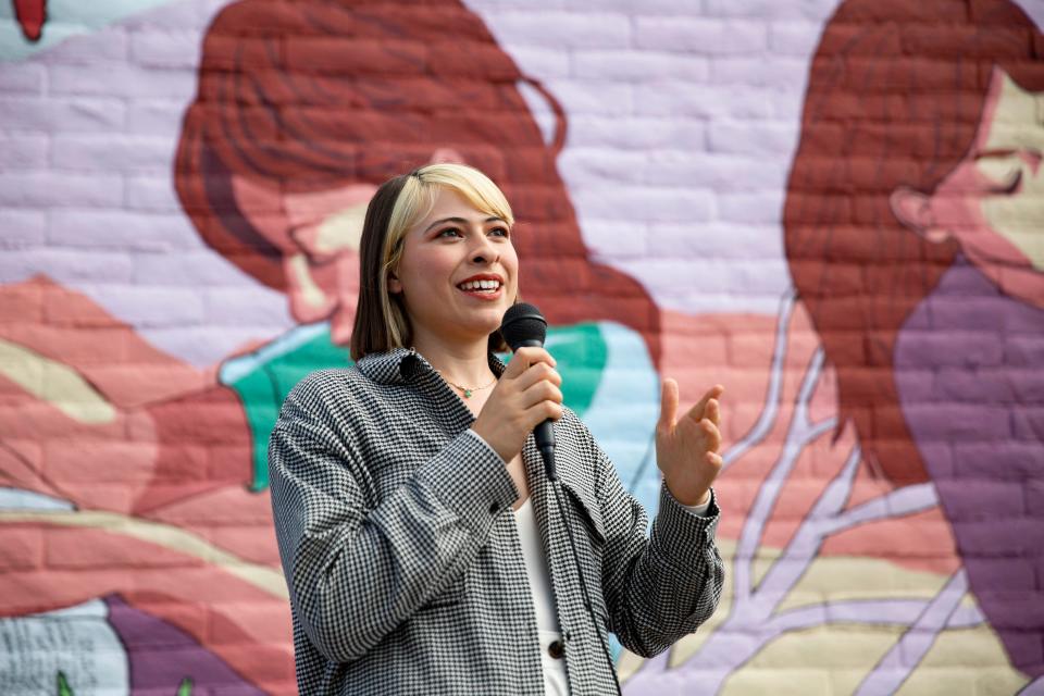 Artist Raquel Madrigal speaks in front of the mural she painted during the Lift Up Las Cruces mural unveiling on Friday, Aug. 26, 2022, at the Cravings Catering building. 