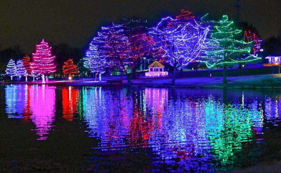 Holiday lights reflect off the lake on Tuesday, Dec. 6, 2022, at Sar-Ko-Par Trails Park in Lenexa.