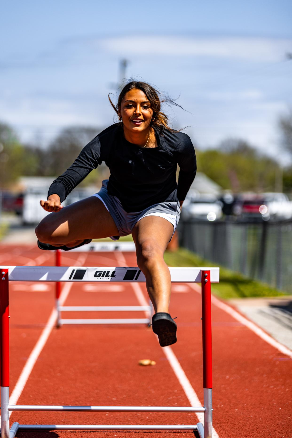 Dewey's Kayah Weathers jumps a few hurdles during practice.