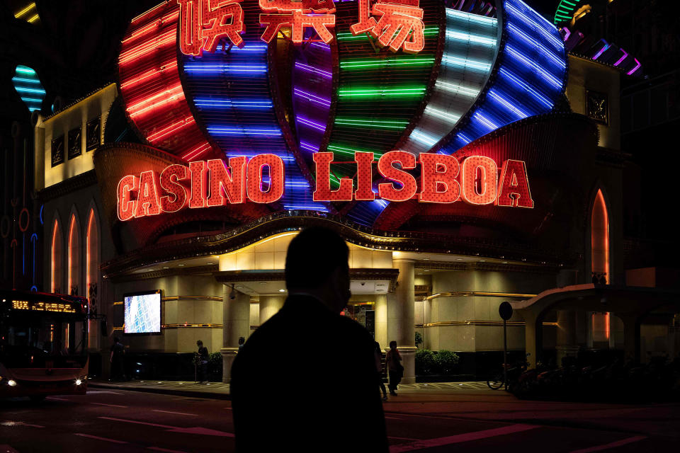 Pedestrians walking past Casino Lisboa in Macau, Oct. 20.<span class="copyright">Eduardo Leal—AFP/Getty Images</span>