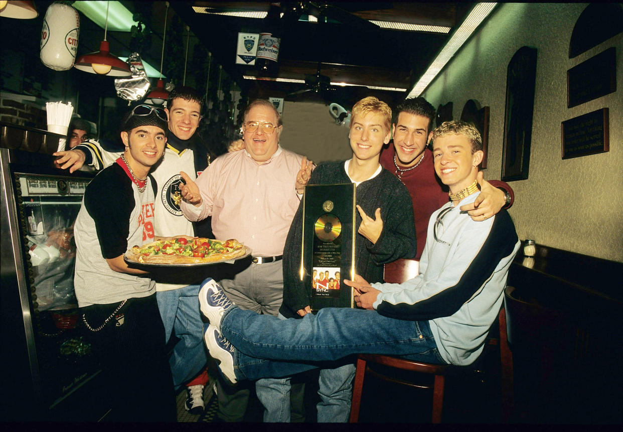 Lou Pearlman, center, poses with, from left, NSync's Chris Kirkpatrick, JC Chasez,  Lance Bass, Joey Fatone and Justin Timberlake.