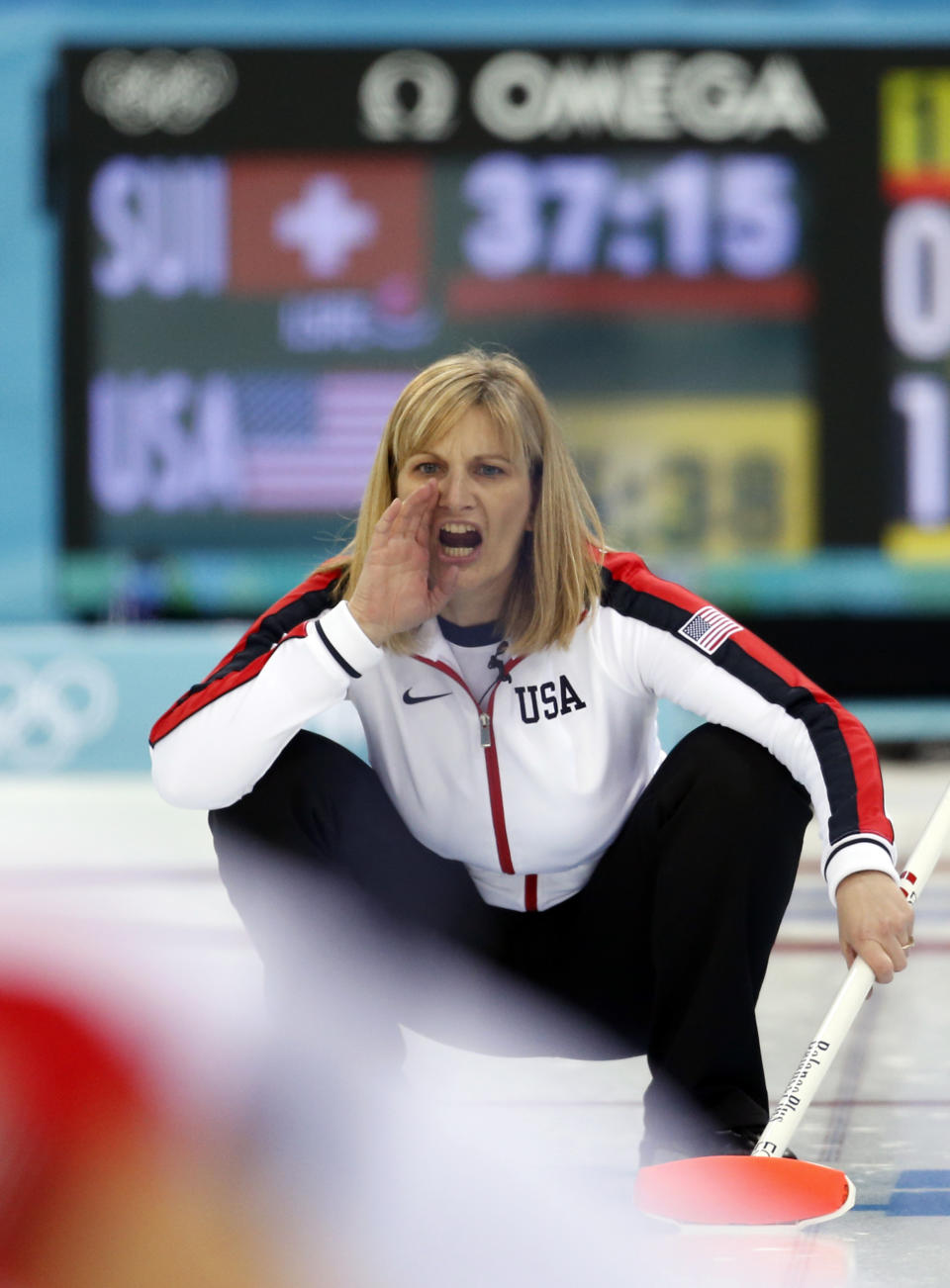 Team USA’s skip Erika Brown shouts instructions to her teammates after delivering the rock during women's curling competition against Switzerland at the 2014 Winter Olympics, Monday, Feb. 10, 2014, in Sochi, Russia. (AP Photo/Robert F. Bukaty)