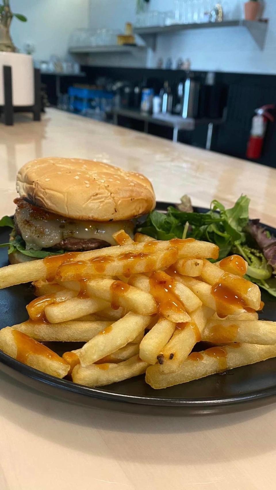 The Maggie Thai Burger comes with fries drizzled with Pad Thai sauce.