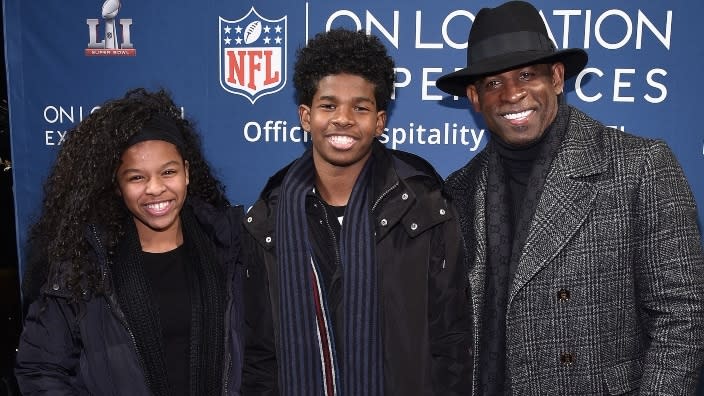 This 2016 photo shows (from left) Shelomi Sanders, Shedeur Sanders and their father, former NFL football player Deion Sanders, at STK Rooftop in New York City. (Photo: Bryan Bedder/Getty Images)