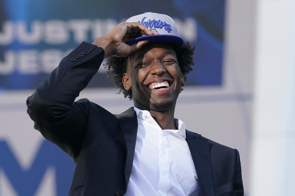 Golden State Warriors draft pick James Wiseman laughs during a news conference.