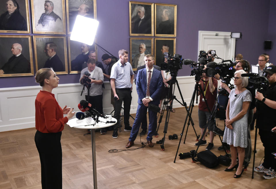 Mette Frederiksen of The Danish Social Democrats address the media after finalizing the government negotiations shortly after midnight at Christiansborg Castle in Copenhagen, Denmark, early Wednesday June 26, 2019. Frederiksen announced that The Danish Social Democrats will form a minority government backed by three other left-wing parties. (Mads Claus Rasmussen/Ritzau Scanpix via AP)